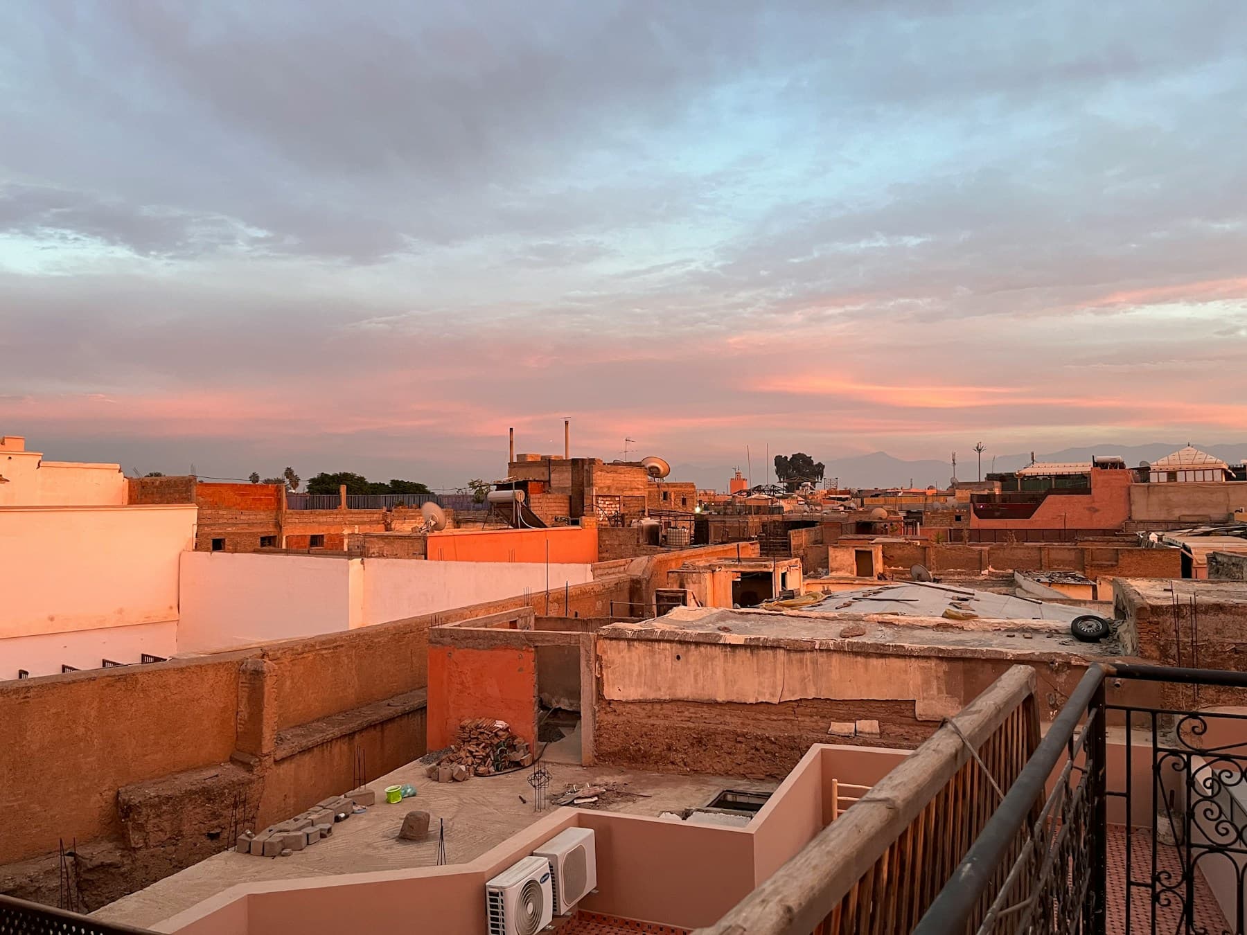 View over Marrakech rooftops for an Airbnb owner guide about the market and neighborhoods.